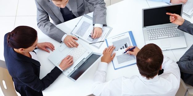 top-view-co-workers-planning-strategy_1098-2959