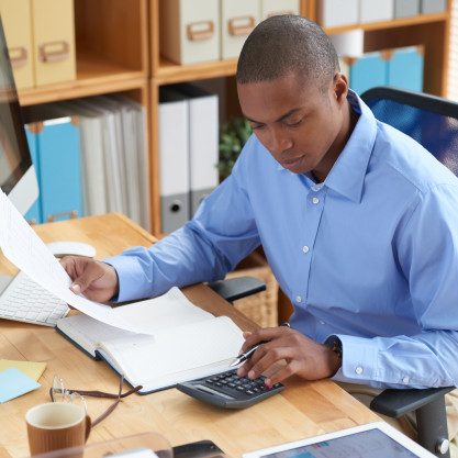 high-angle-view-male-accountant-checking-financial-document_1098-18854