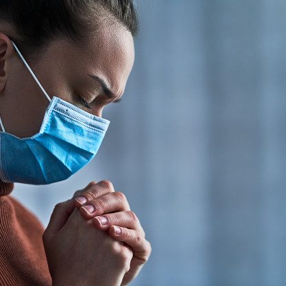 woman-protective-mask-with-closed-eyes-praying-hands-asks-god-healing-recovery-during-illness_122732-2632