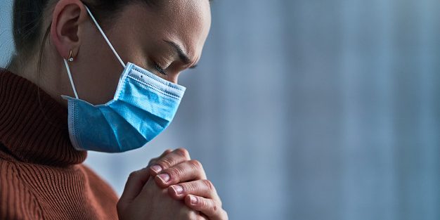 woman-protective-mask-with-closed-eyes-praying-hands-asks-god-healing-recovery-during-illness_122732-2632