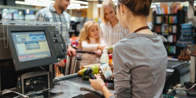 beautiful-family-standing-cash-counter_171337-2410