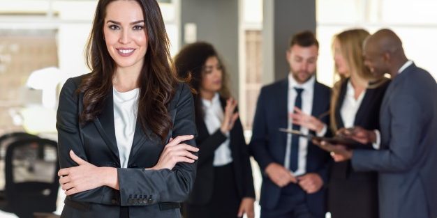 businesswoman-leader-modern-office-with-businesspeople-workin_1139-954