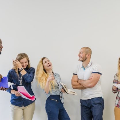 laughing-people-collaborating-studying_23-2147655809