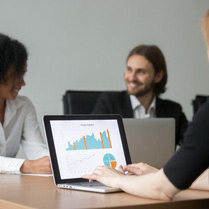 businesswoman-working-with-project-statistics-preparing-report-team-meeting_1163-3899