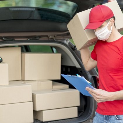 delivery-guy-wearing-mask-holding-pack_23-2148546086