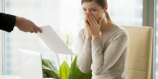 employer-giving-dismissal-notice-young-woman_1163-5373