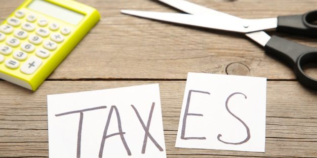 text-tax-scissors-concept-tax-cut-grey-background_106006-3940