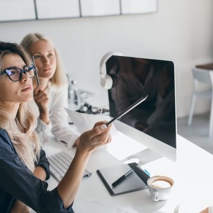 thoughtful-blonde-woman-glasses-holding-pencil-looking-away-during-work-office-indoor-portrait-busy-long-haired-female-accountant-using-computer_197531-3763