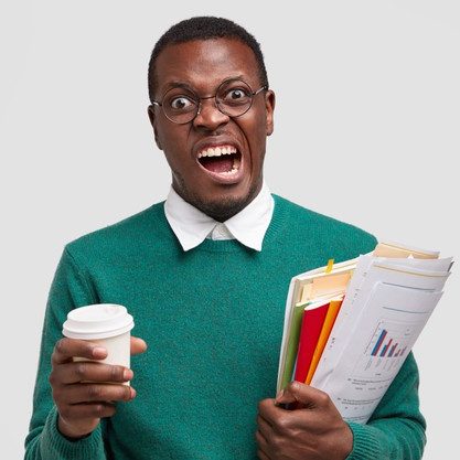 annoyed-dark-skinned-male-frowns-face-doesnt-want-study-economy-market-money-tax-being-investment-consultant-analyzes-company-annual-report_273609-24667
