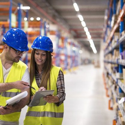 warehouse-workers-checking-inventory-consulting-each-other-about-organization-distribution-goods_342744-1539