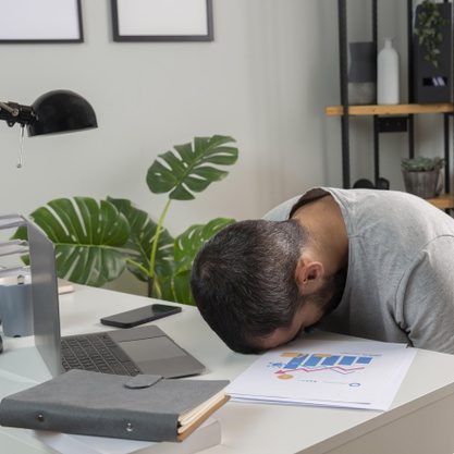 man-feeling-sleepy-while-working-from-home_23-2148806683