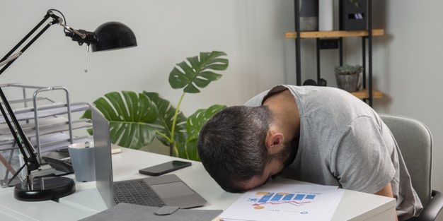 man-feeling-sleepy-while-working-from-home_23-2148806683