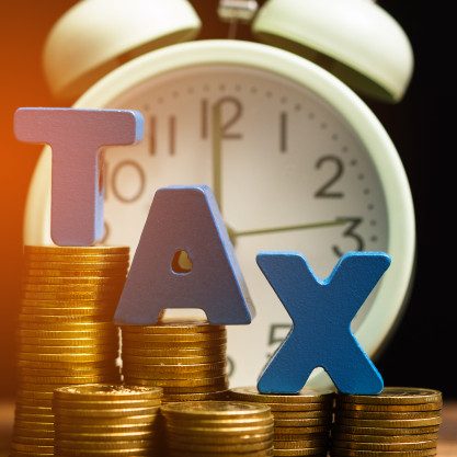 tax-alphabet-with-stack-coin-vintage-alarm-clock_26018-1859
