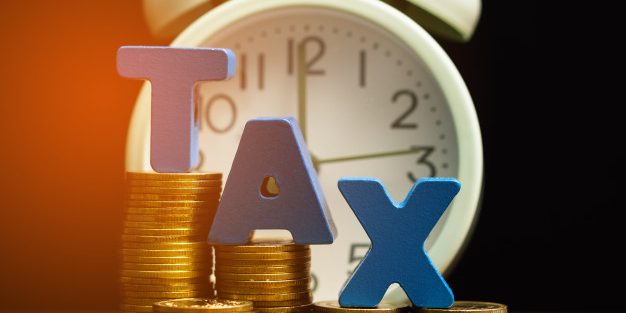 tax-alphabet-with-stack-coin-vintage-alarm-clock_26018-1859