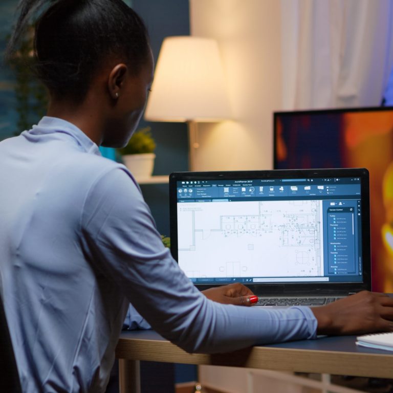 black-employee-checking-digital-blue-prints-analysing-project-company-looking-laptop-sitting-desk-living-room-office-late-night-overtime-busy-african-freelancer-using-modern-technology