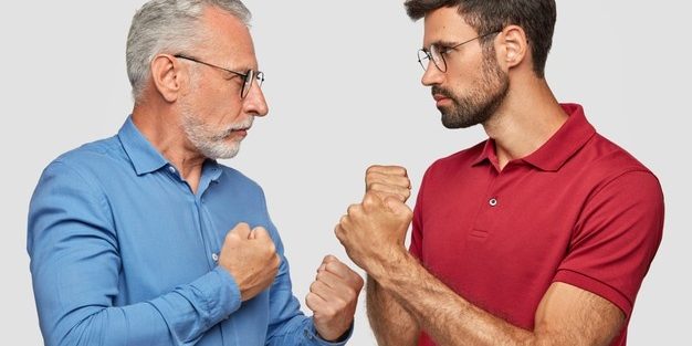 sideways-shot-two-men-competitors-look-seriously-each-other-keeps-hand-clenched-fists-ready-fight-can-t-share-common-business-stand-against-white-wall-people-competition_273609-16180