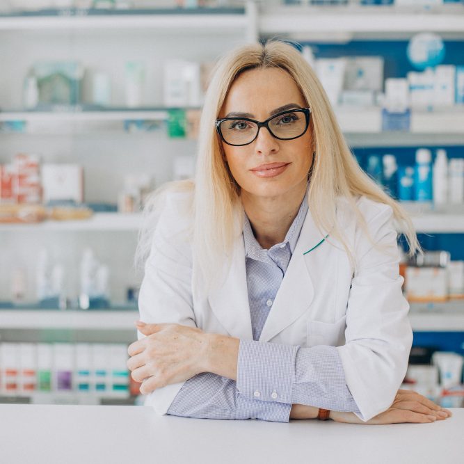 woman-working-pharmacy-wearing-coat