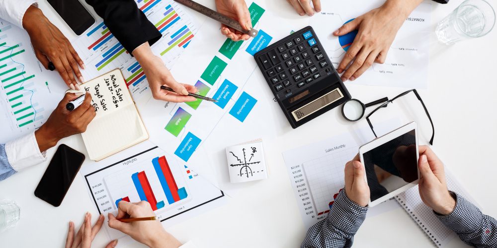 businessmen-hands-white-table-with-documents-drafts